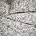 Close-up of IKEA RODGERSIA grey white paisley pattern on cotton-viscose fabric