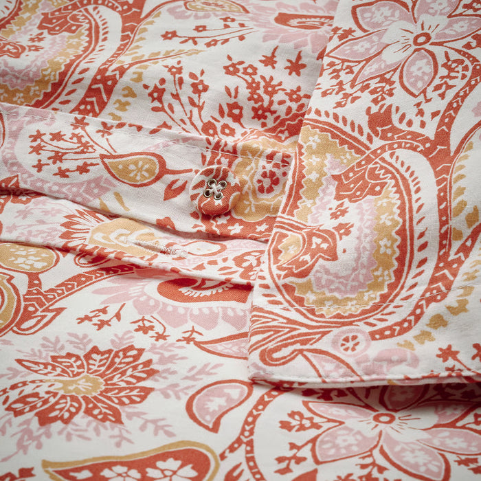 Close-up of IKEA RODGERSIA pink white paisley print showing fabric texture and detail
