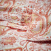 Close-up of IKEA RODGERSIA pink white paisley print showing fabric texture and detail