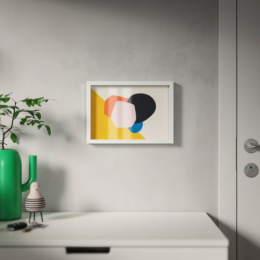 IKEA RÖDALM white frame with abstract print on grey wall, styled with green vase and decorative objects