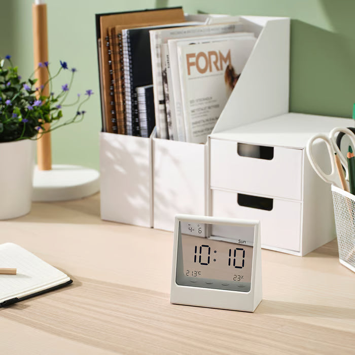 IKEA RÖDBENA white alarm clock side angle view showing compact 5cm depth profile