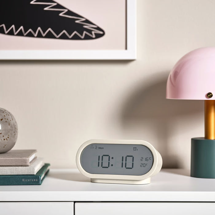 KEA RÖDSTRÄFSE beige bedside clock on nightstand simple modern design