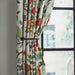 IKEA RÖRNICKA black tie-back close-up showing curved shape and aluminium finial detail
