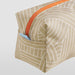 Close-up of IKEA ROMELSÖN beige accessory bag with intricate white pattern orange and blue zip detail