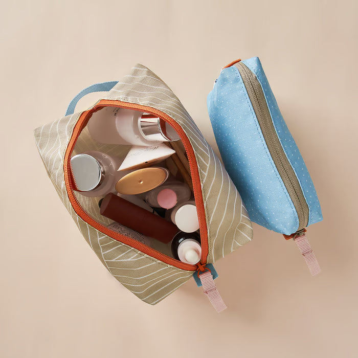 IKEA ROMELSÖN two patterned accessory bags filled with cosmetics and cables desk and bathroom use