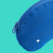 Close-up of IKEA ROMELSÖN blue recycled polyester zip accessory bag on teal background