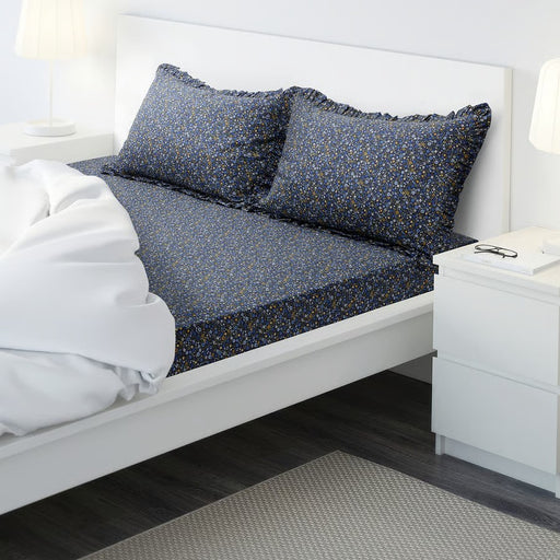 "A ceramic mug with a white base featuring an artistic blue splatter pattern and a sturdy handle. The handcrafted design adds a unique and stylish touch, making it perfect for coffee, tea, or other beverages