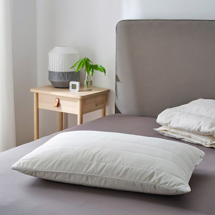 IKEA RUMSMALVA Pillow positioned on a neatly made bed, ideal for restful sleep