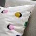 Close-up of the IKEA RUNDKRASSING cushion cover with a white multicolour dot design, measuring 50x50 cm (20x20"). 10582804     
