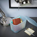 IKEA RYKTA grey-blue storage box with lid on desk organising stationery pens and notebooks with lamp nearby