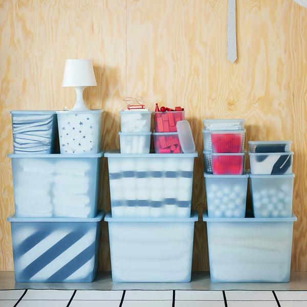 IKEA RYKTA grey-blue storage boxes multiple sizes stacked together on light wood surface showing size range