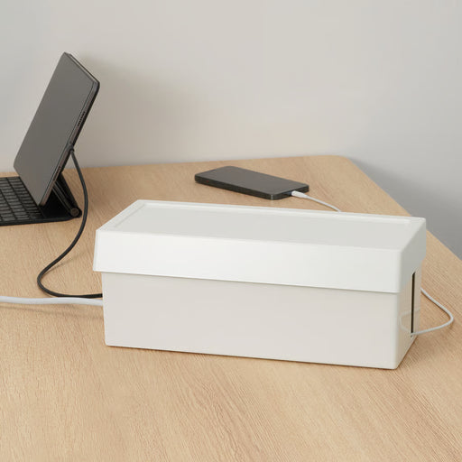 IKEA SÄTTING white cable management box on desk beside tablet and phone hiding cables