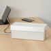 IKEA SÄTTING white cable management box on desk beside tablet and phone hiding cables