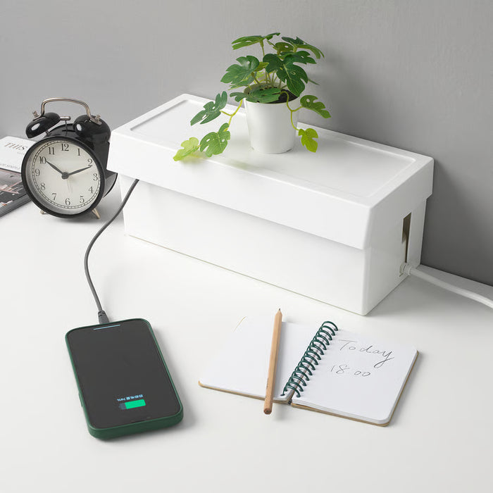  IKEA SÄTTING white cable box on clean desk with alarm clock plant and notepad charging phone