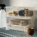 Clear stacked IKEA SAMLA boxes with lids for organising strings and clips