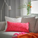 IKEA SANDMOTT bright red cushion styled on grey sofa living room setting