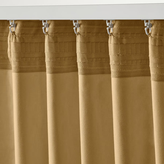 Close-up of IKEA SANELA curtain textured weave with metal hooks for light filtering