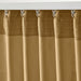 Close-up of IKEA SANELA curtain textured weave with metal hooks for light filtering