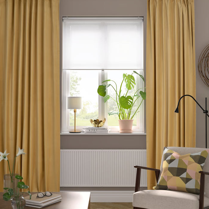 IKEA SANELA beige-yellow velvet curtains in cosy room with plant, lamp and chair
