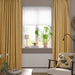 IKEA SANELA beige-yellow velvet curtains in cosy room with plant, lamp and chair
