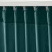 Person hanging IKEA SANELA velvet curtains on a rod, installation step shown