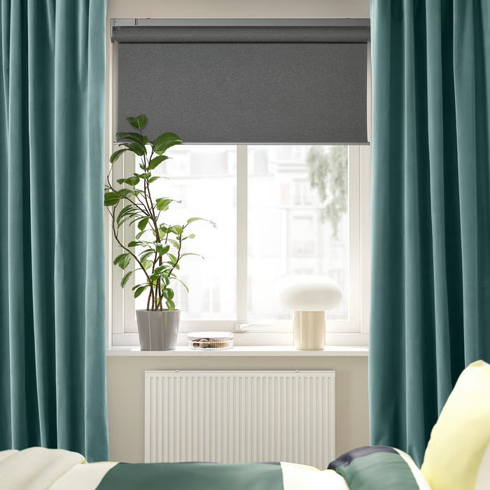 IKEA SANELA curtains folded product shot showing dark grey-turquoise velvet texture