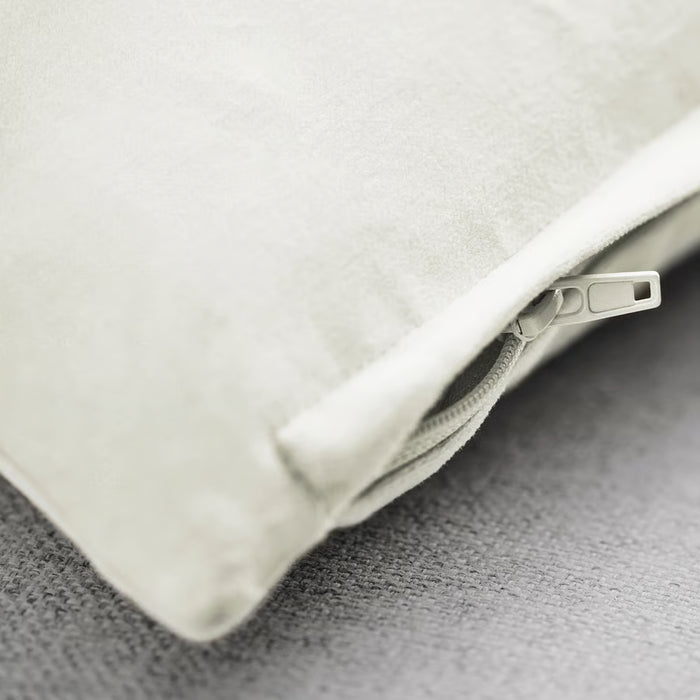Close-up of IKEA SANELA off-white cotton velvet cushion cover showing zip and texture