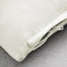 Close-up of IKEA SANELA off-white cotton velvet cushion cover showing zip and texture