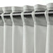 Close-up of IKEA SILVERLÖNN heading tape clips designed for creating neat pleats