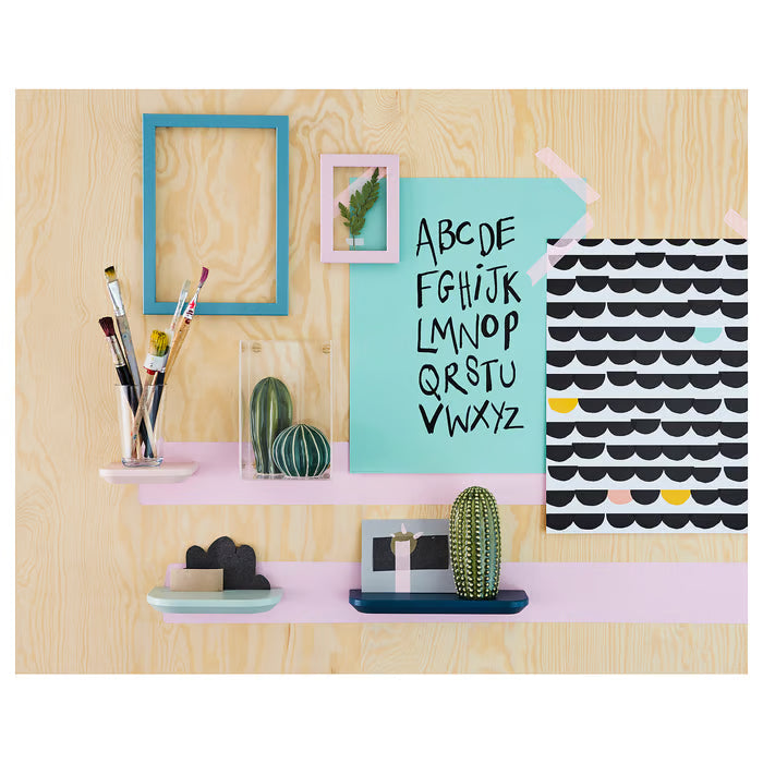 IKEA SJÄLSLIGT ceramic cacti on a wooden desk with colourful frames and stationery in a study setup