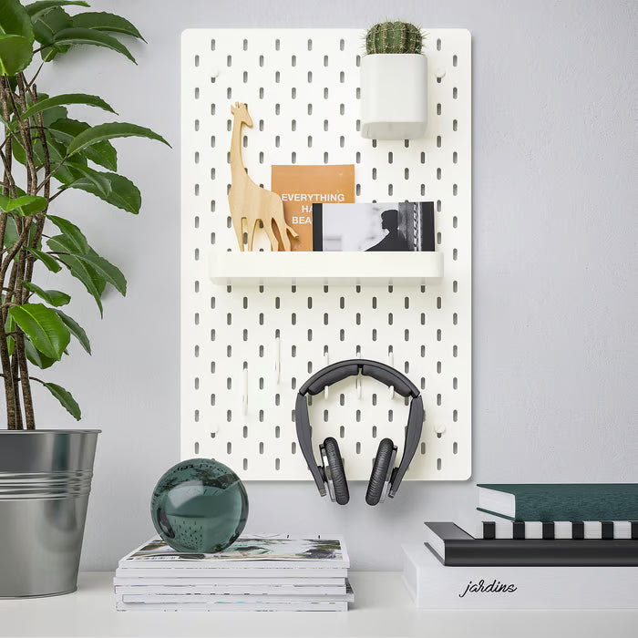 IKEA SKÅDIS white container close-up showing powder-coated steel finish and mounting hook