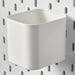 IKEA SKÅDIS white container on a white pegboard with other SKÅDIS accessories for organised workspace

