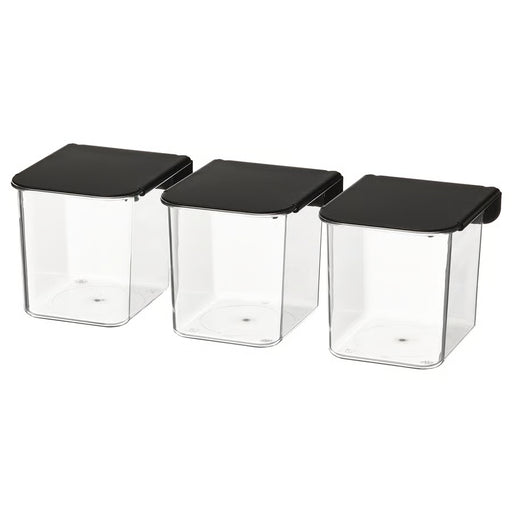 IKEA SKÅDIS clear storage containers with black hinged lids stacked in a row #70569927