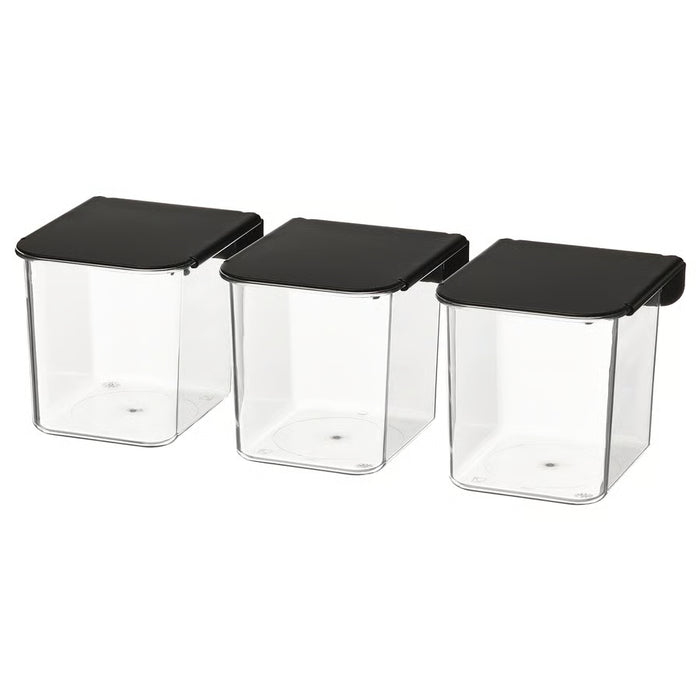 IKEA SKÅDIS clear storage containers with black hinged lids stacked in a row #70569927