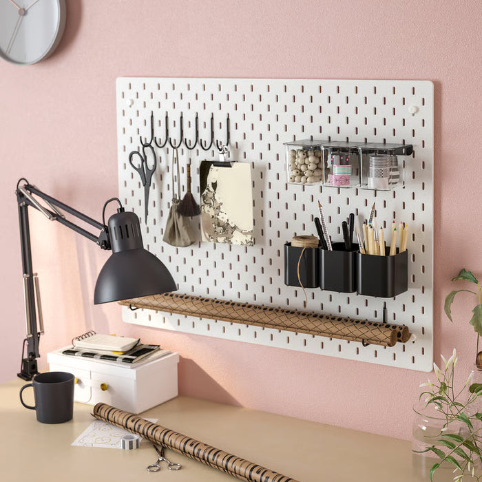 IKEA SKÅDIS containers on pegboard in an organised home office desk setup