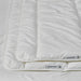  IKEA SKOGSFRÄKEN 3-in-1 duvet demonstration showing light and warm layers being separated and rejoined