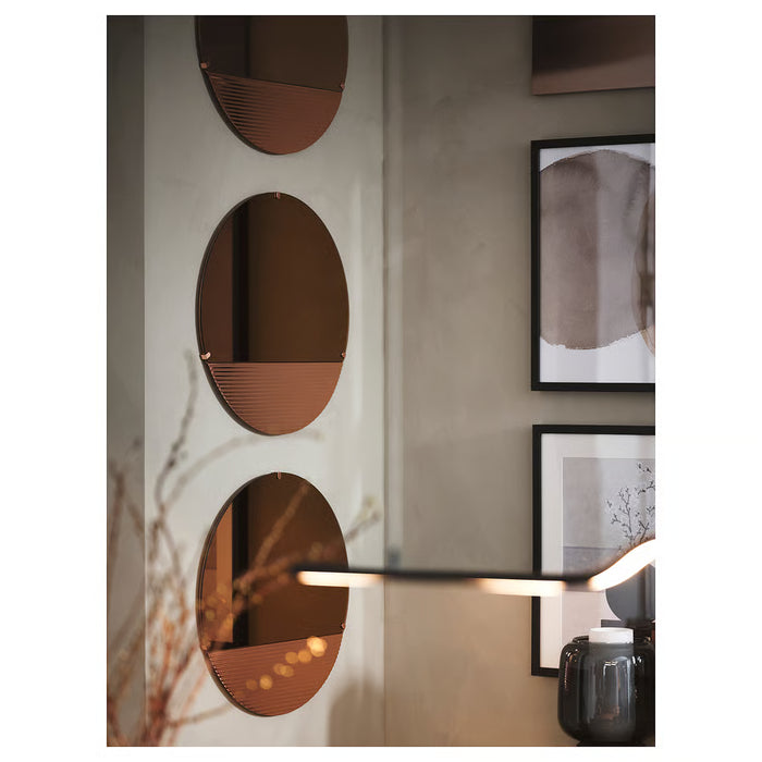 IKEA SKOGSGRÄNSEN mirror wavy bottom edge close view on white wall