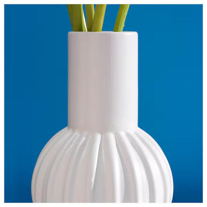 "Versatile IKEA vase displayed in different settings, showing its adaptability to various interior styles and decor themes."