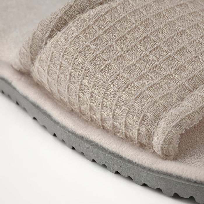 IKEA SKOVELSJÖN beige slipper top-down view highlighting waffle-textured fabric