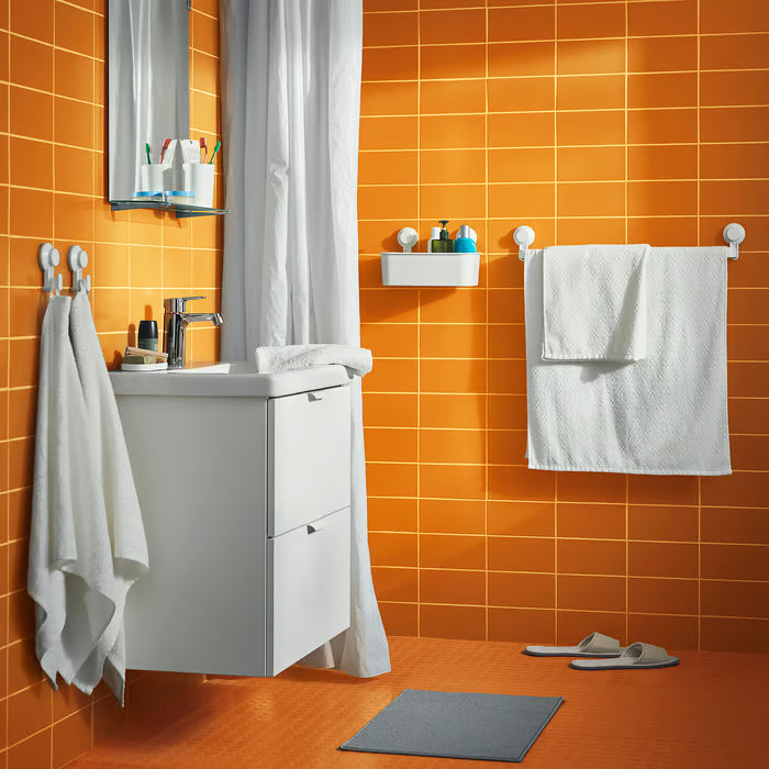  IKEA SKOVELSJÖN beige slippers paired with a matching BJÄLVEN bathrobe in a bathroom spa setup