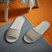 IKEA SKOVELSJÖN beige slippers worn in a cozy home setting on a wooden floor