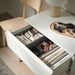 IKEA SKUBB dark grey boxes set of 3 arranged inside open wardrobe drawer with folded clothes