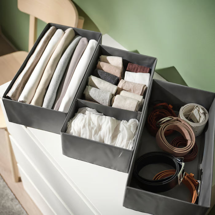 IKEA SKUBB dark grey organiser boxes separating socks and accessories in chest of drawers