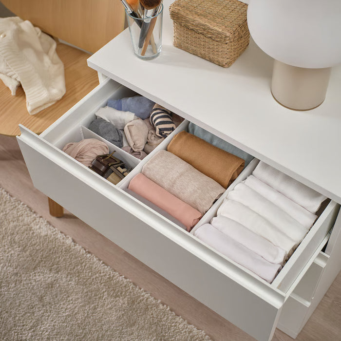 IKEA SKUBB white boxes organising folded clothes in a drawer