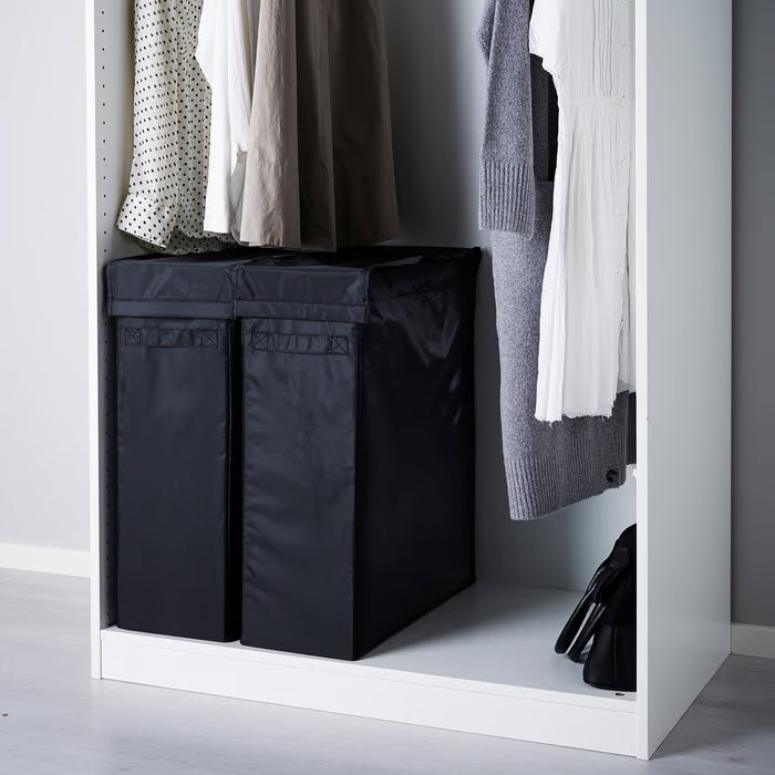 IKEA SKUBB black laundry bags inside open PAX wardrobe keeping clothes organised and floor clear