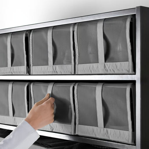 Hand pulling IKEA SKUBB dark grey shoe box from wardrobe shelf showing easy access mesh front