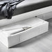 IKEA SKUBB white storage case open under bed with folded blankets and seasonal bedding inside