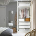 Open wardrobe with IKEA SKUBB white cases neatly holding clothes and accessories on shelves