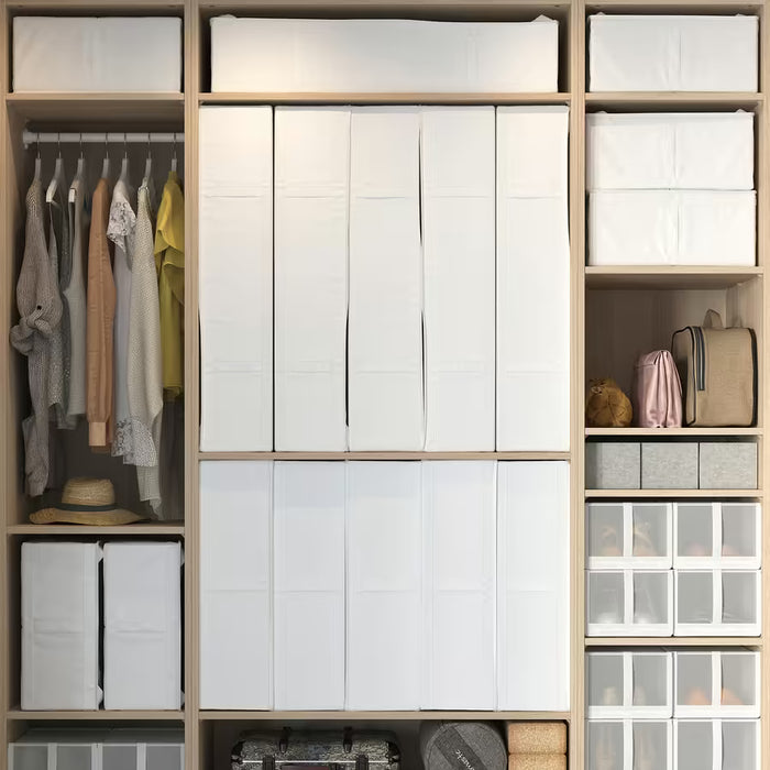 Neat white bedroom wardrobe with IKEA SKUBB white storage cases stacked and organised on shelves