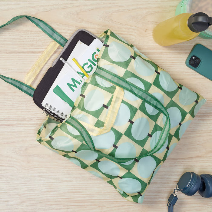 IKEA SKYNKE pale yellow multicolour bag packed with items showing capacity